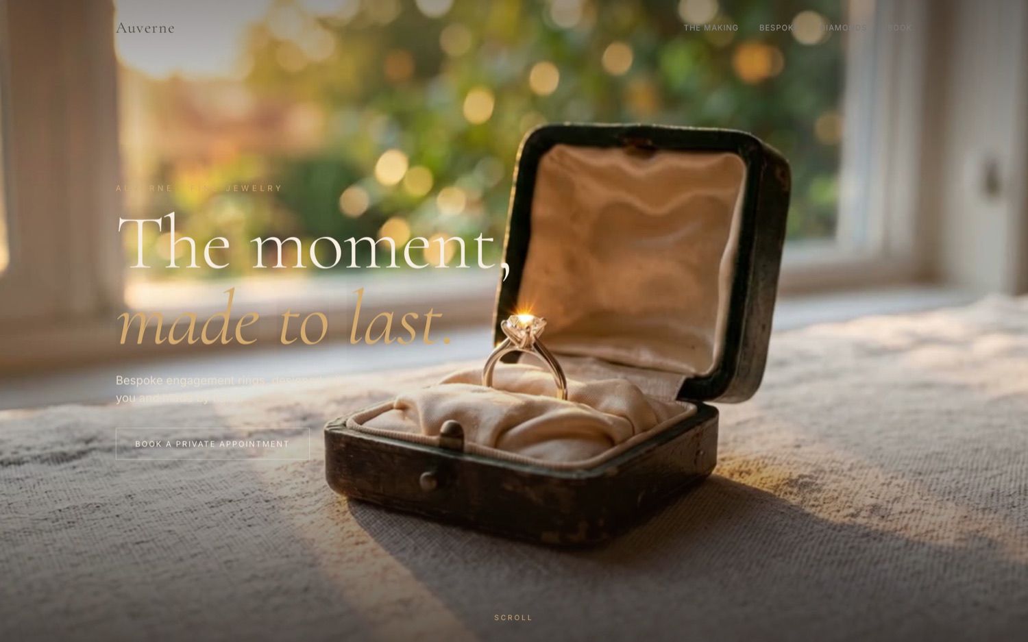 A solitaire ring in a worn dark green velvet box on white linen, backlit by a window.